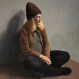 Woman with Knit Hat and Mobile Device by Rick Perez