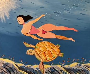 A woman is swimming with a sea turtle at Liuqiu of Taiwan thumb