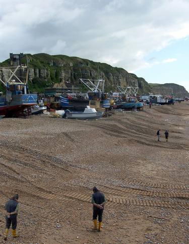 Poor Fisherman looking for coins on the beach, no fish to catch thumb