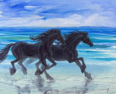Friesian horses running on beach thumb