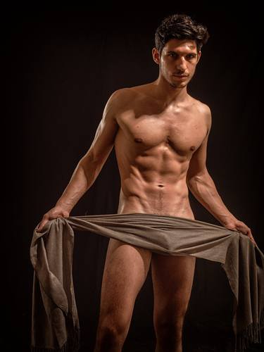 Male nude with scarf. A naked man unwilling to hide. thumb