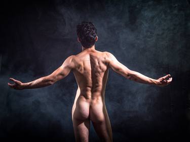 Naked man's back. Exercise on male nude. thumb