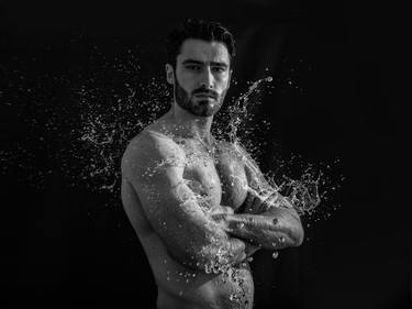 Splash of water on male nude. thumb