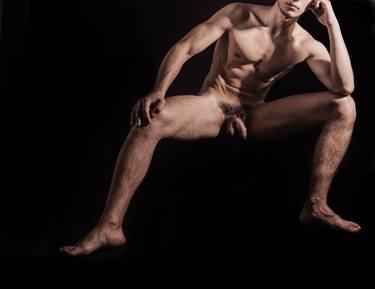 Male nude, baring it all. Naked man sitting thumb