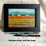 Framed view of tulip farm landscape
