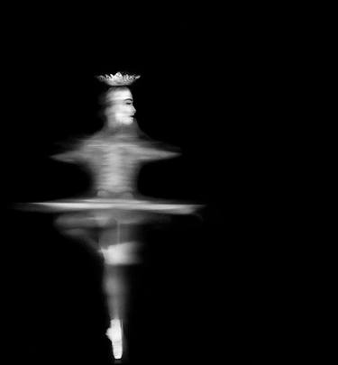 A ballerina dancing in a black and white photo. thumb