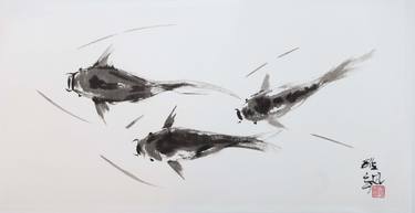 Three koi fish swimming in clear waters. thumb