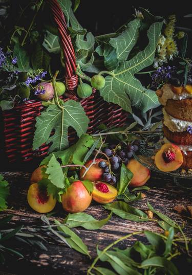 A basket of nectarines and grapes thumb