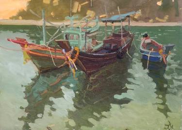 "A trio of traditional Thai boats in the water of Siam Bay" thumb