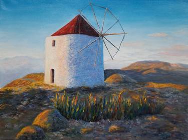 Greek windmill on top of the mountain in the rays of sunset thumb