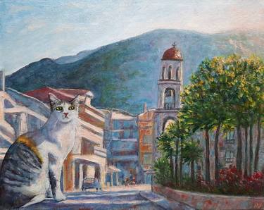 Calico cat in the morning sun in the street of Greece thumb
