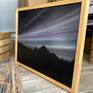 In a Natural wood frame