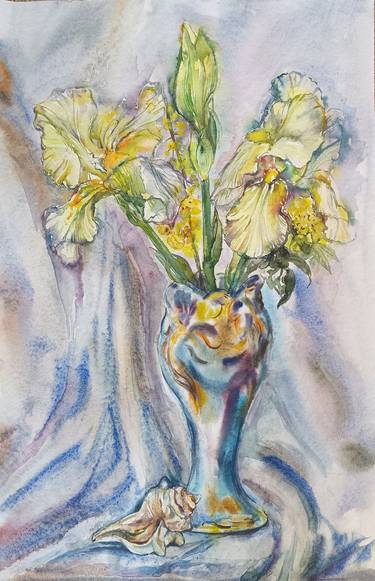 Still life.Yellow irises in a blue vase. thumb