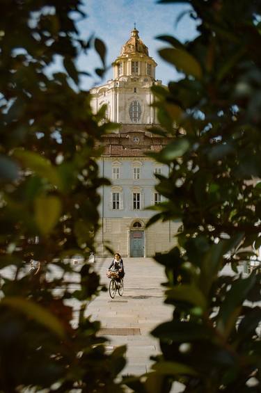 Woman on a bicycle. Turin thumb