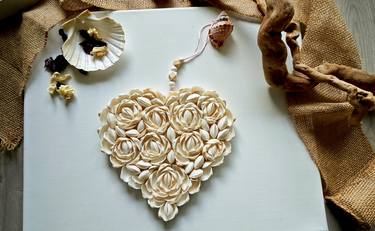 Heart made of shells in the form of roses thumb