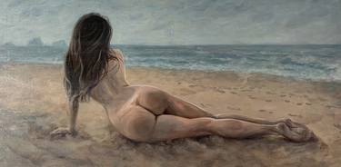 A girl on the beach on a cloudy sea day thumb