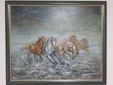 Galloping horses on snow thumb