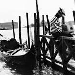 Gondolier reading the newspaper, Venice 2009 by Rodion Kovenkin