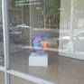 Sculpture with plastic, painted with acrylic paint. Sits on top of a glass stand (included with sculpture)