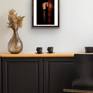 Elegantly displayed in dark wooden frame