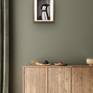 Wooden frame on green wall