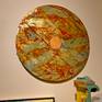 Somewhat unconventional, this disc with a orange center is made of insulation foam board mounted on plywood. On top of the foam board irregular strips of metal tape are applied on top of which paint is troweled. The center is a separate piece painted opaquely.