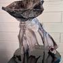 Blue and green swirling resin sculpture.