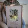 Artist with the framed work