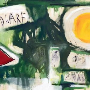 A DWARF IS SITTING IN THE GRAS