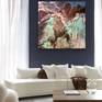 Blue wall with large colorful abstract artwork