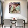 Elegant dining space with artwork and plants