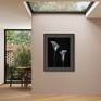 Black frame and dark-tinted mat framing style.