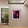 Black frame and mat (passepartout) framing style.