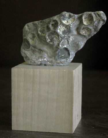 Sculptural form in the form of a piece of the Moon with craters thumb