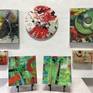 Small Art wall of 12" x 12" 8" x 8" and 5" x 5" paintings.