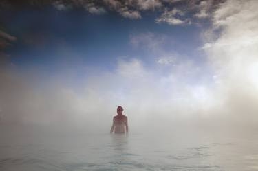 Man standing in geothermal lagoon thumb