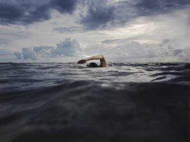 Man swimming in sea image