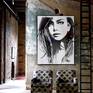 white series painting framed and hung in a room