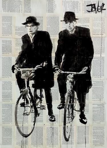 two men on bikes image