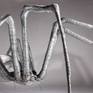 Fear is what many people have from spiders. This metal piece recreates this creature in a much larger scale than nature, but preserving all details, proportions, and the vivacity of this disturbing animal It has been created to be self standing on its legs to provide it with the sensation of movement. This piece is part of Isasa’s ‘Creatures’ series.