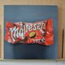 An original, one off painting of the ever recognisable Malteser bag against a dark grey background to really show its rich colour. Hand painted on MDF wood canvas coated in a layer of satin varnish that gives a crisp, detailed finish.Painted in the style of Photorealism with oil paints this piece really captures your attention with its vivid colours, depth and intense realism.
