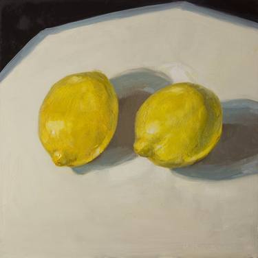 modern still life of two yellow lemons on white and black thumb