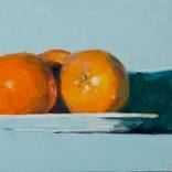 modern still life of orange on light blue by olivier payeur