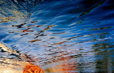 upside down sunset reflected in the boats trail... thumb