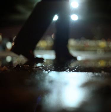 Man walking at night with urban city lights artistic color medium format square negative analog film photo thumb