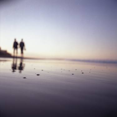 Two people walking on beach on summer evening Hasselblad medium format film analog photograph thumb