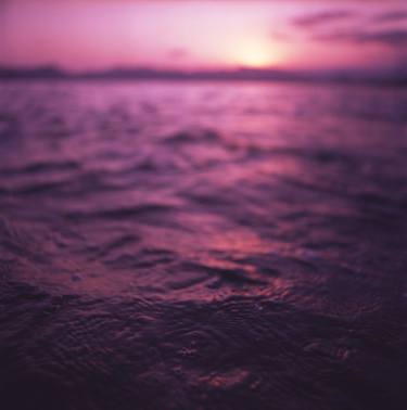 Mediterranean sea water off Ibiza Spain in surreal purple sunset evening dusk colors film analog photo thumb