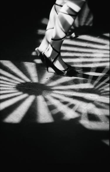 Feet of girl dancing in nightclub lights black and white silver gelatin 35mm film analog photograph thumb
