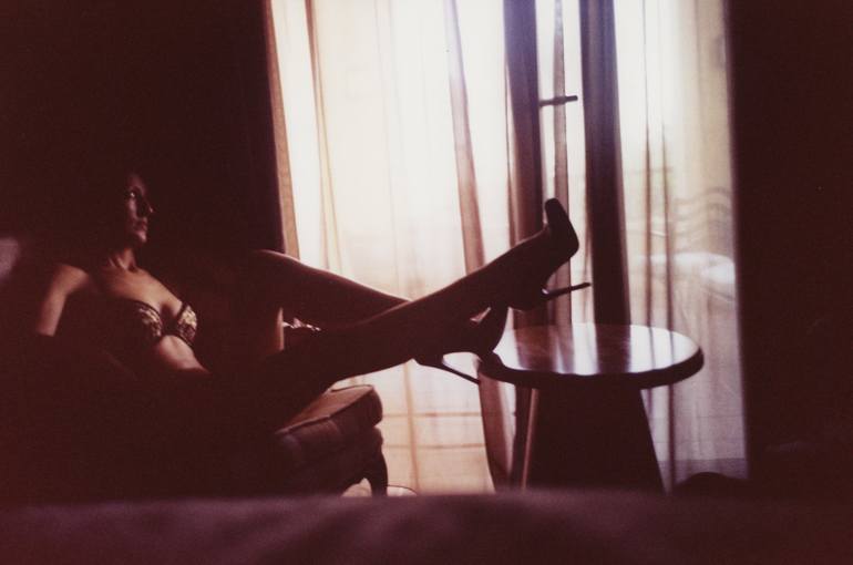Sexy young lady in lingerie in hotel suite bedroom on chair color 35m xpro  c41 film analog photo in reds Photography by Edward Olive | Saatchi Art  Switzerland
