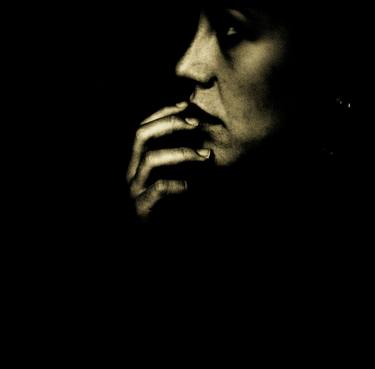 Portrait of young sad woman in darkness black and white 35mm film silver glatin analog photograph  thumb